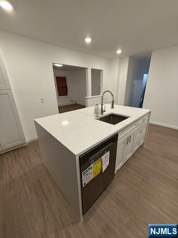 381 Terrace Avenue, Unit 1 Hasbrouck Heights, NJ 07604 - Photo 3 of 3 a kitchen with stainless steel appliances granite countertop a sink a microwave a counter space and cabinets