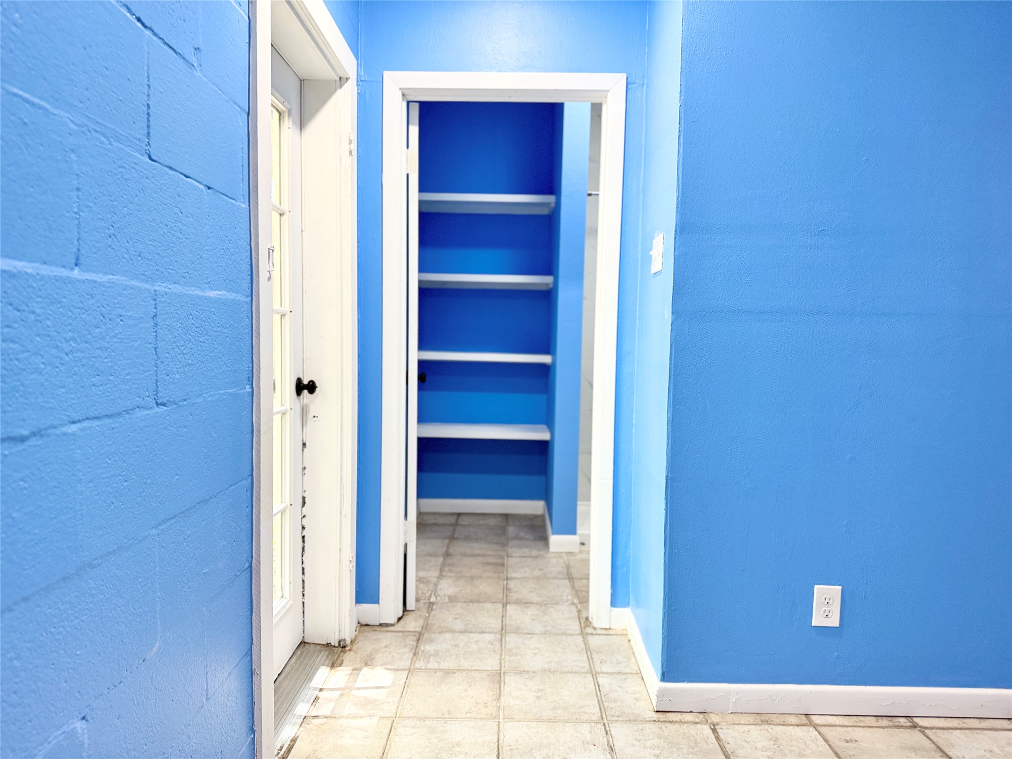 51 Hanging Oak Road Dale, TX 78616 - Photo 27 of 32 Built-in shelving unit providing storage, set within a doorway with white trim