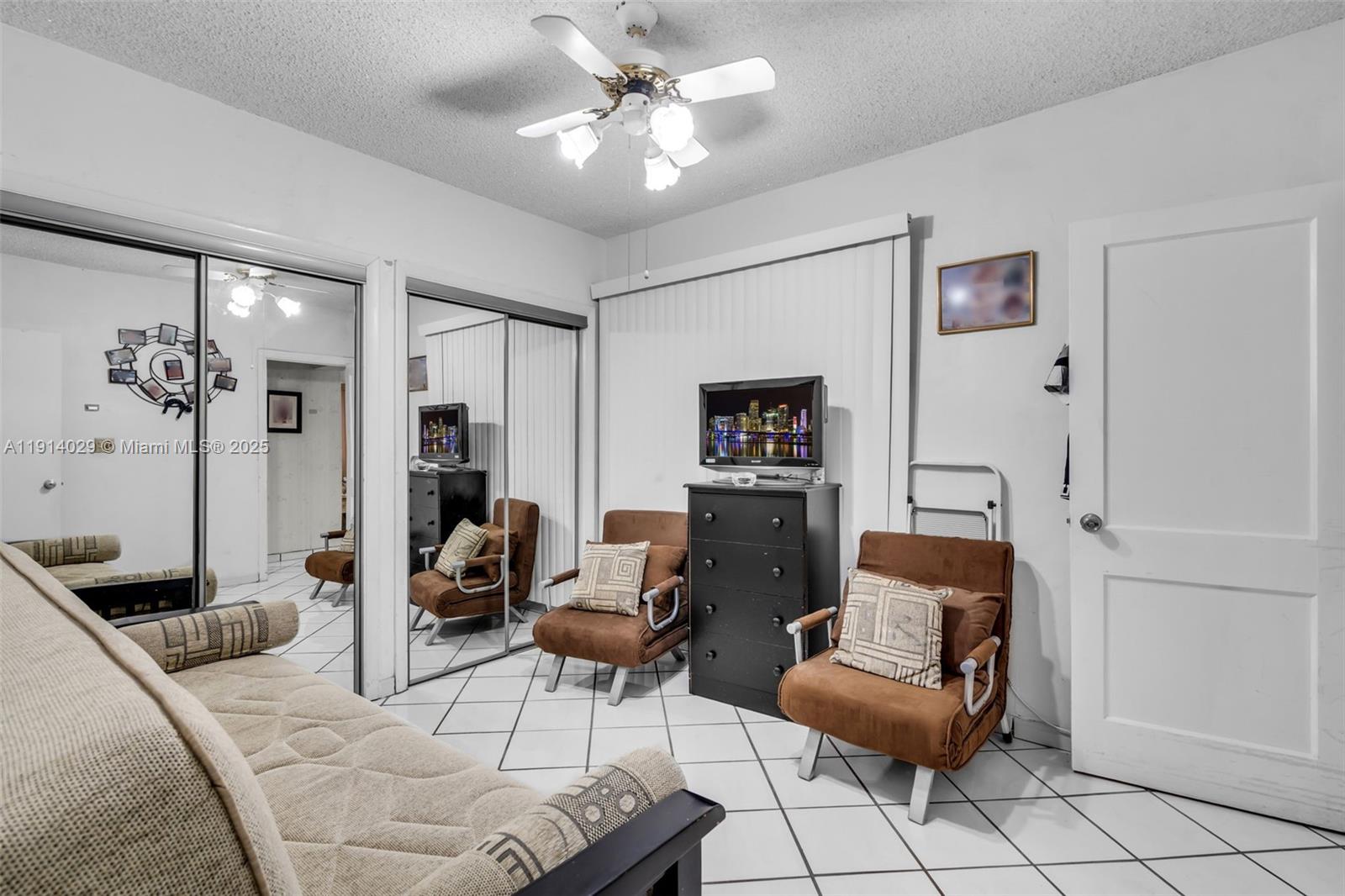 1861 Southwest 19th Street Miami, FL 33145 - Photo 19 of 38 a living room with furniture and a chandelier