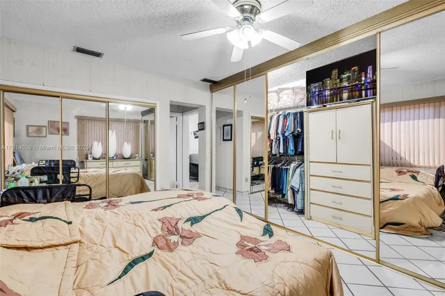 a bed room with a bed and a television