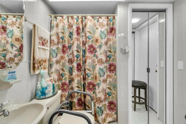 a bathroom with a shower curtain