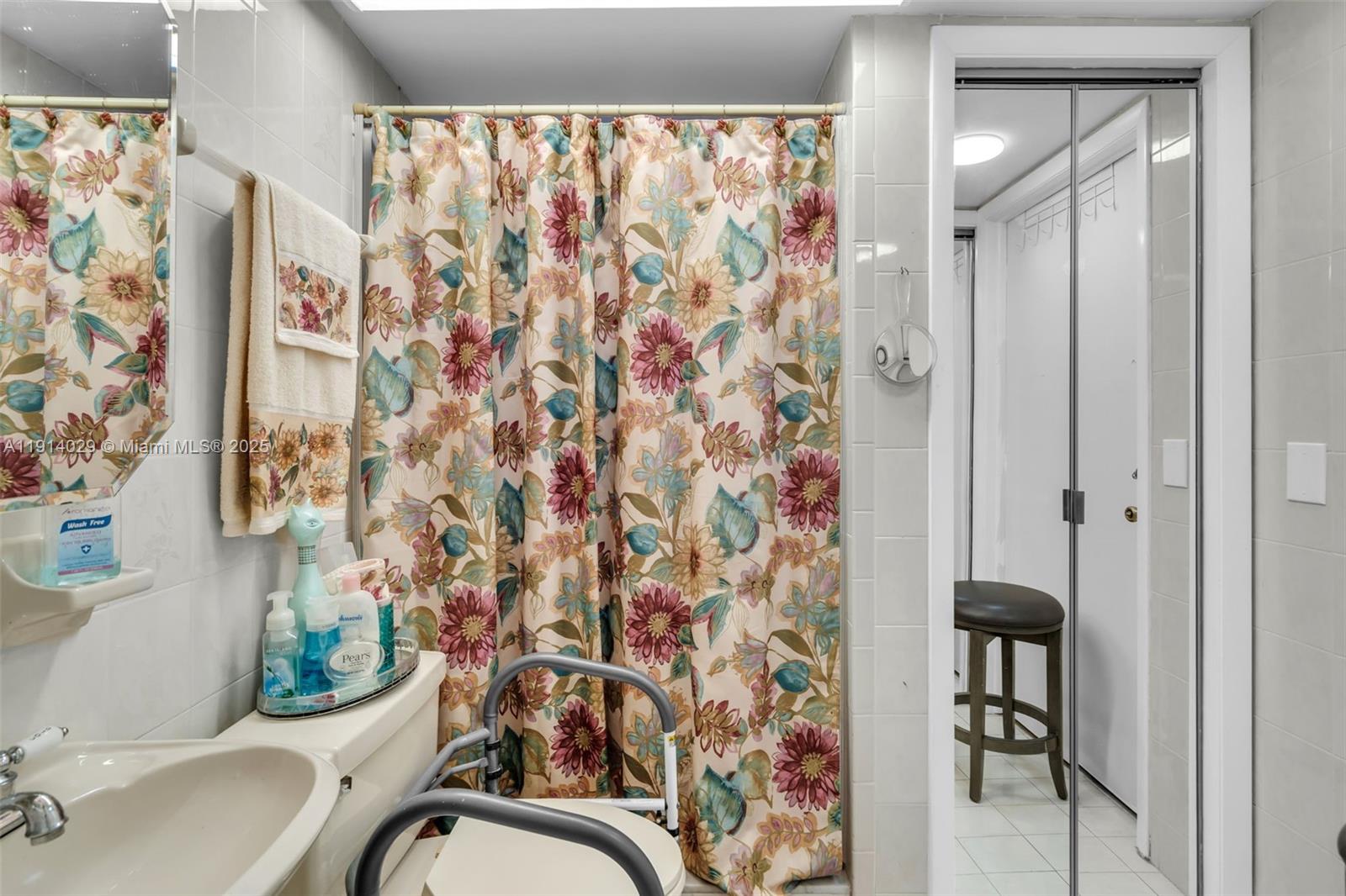 1861 Southwest 19th Street Miami, FL 33145 - Photo 23 of 38 a bathroom with a shower curtain