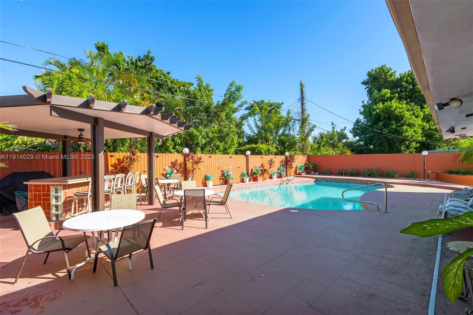 1861 Southwest 19th Street Miami, FL 33145 - Photo 24 of 38 an outdoor sitting area with chairs and table in patio