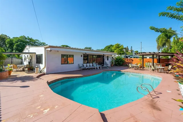 a view of a house with swimming pool
