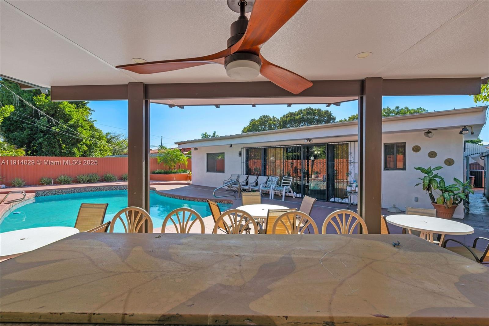 1861 Southwest 19th Street Miami, FL 33145 - Photo 30 of 38 a view of a patio with table and chairs under an umbrella
