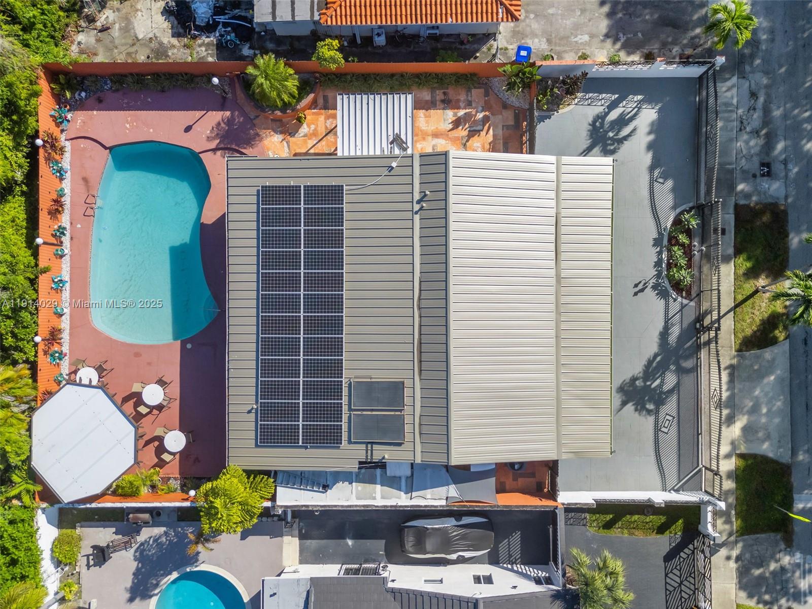 1861 Southwest 19th Street Miami, FL 33145 - Photo 38 of 38 a backyard of a house with outdoor seating