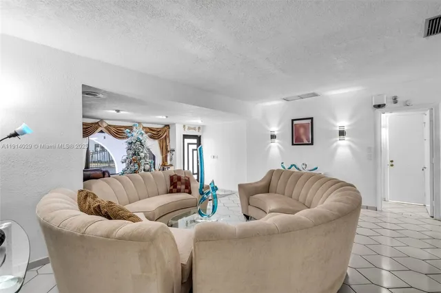 a living room with furniture and a couch