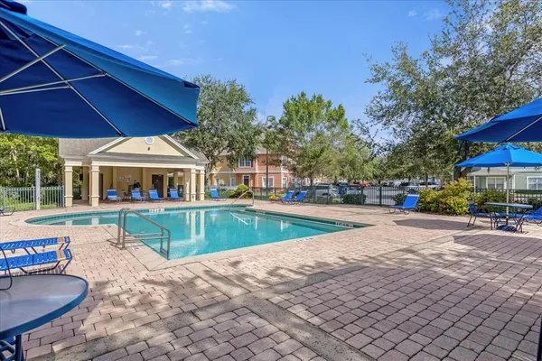 a view of an chairs and tables in the patio