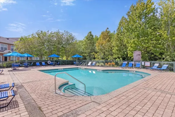 an aerial view of a house swimming pool patio and outdoor seating