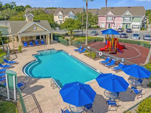 a view of outdoor space with swimming pool and outdoor seating