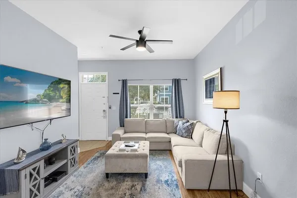 a living room with furniture and a window