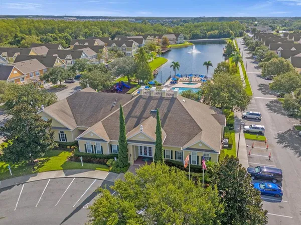 an aerial view of a house with a yard