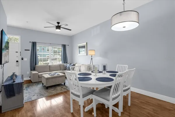 a view of a dining room with furniture window and wooden floor