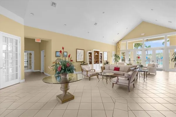 a room with two bed and a table