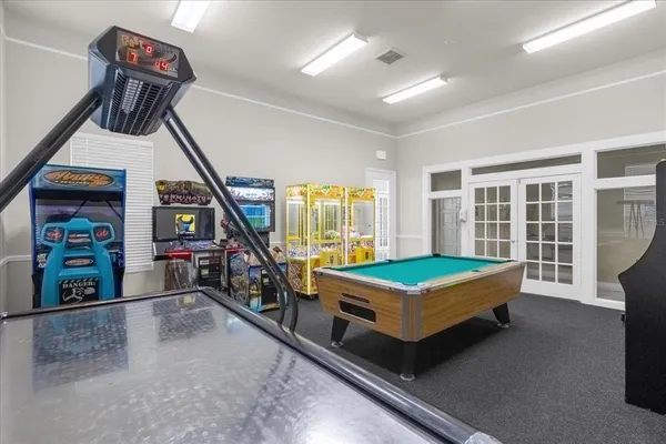 a view of a swimming pool with a lounge chairs