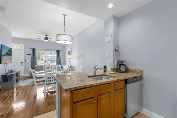 a view of living room with granite countertop furniture and fireplace