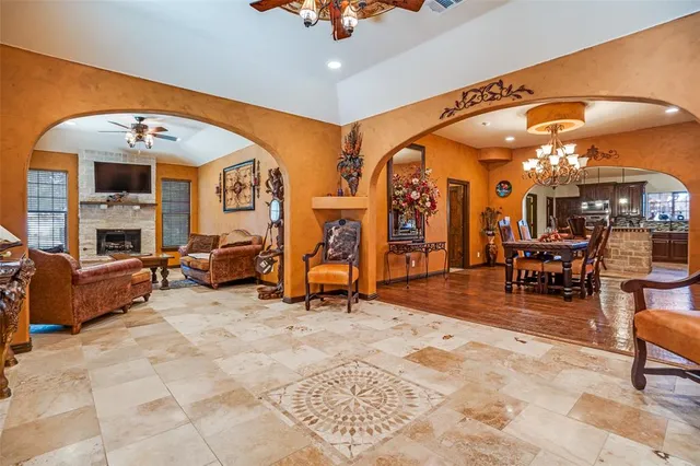 a view of a livingroom with furniture and a gym equipment