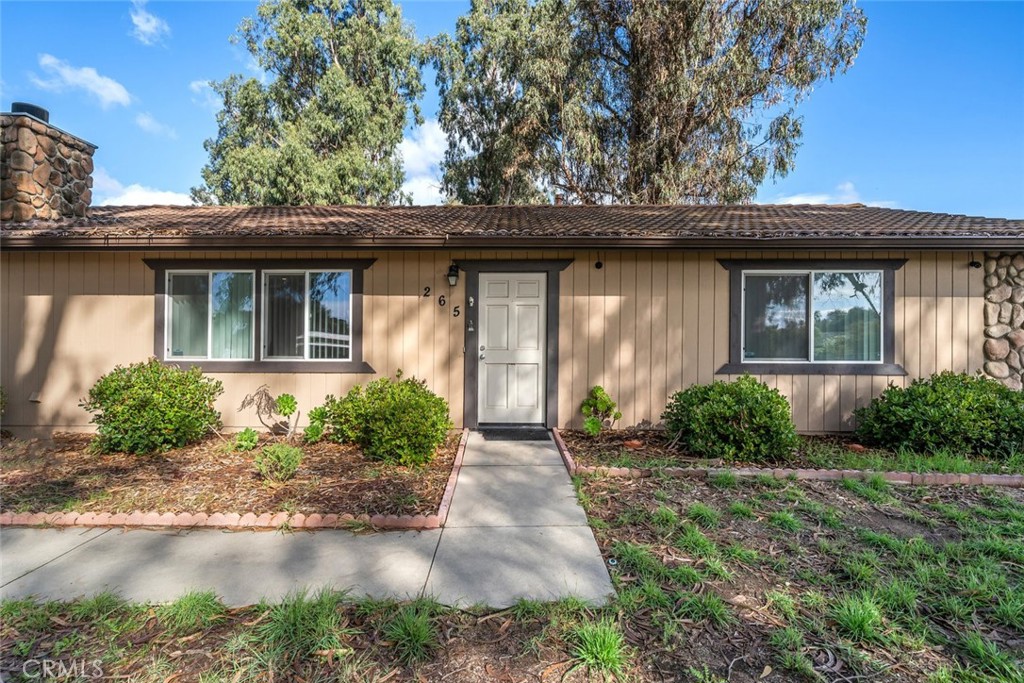 261 Hazel Lane Nipomo, CA 93444 - Photo 34 of 68 a front view of a house with garden