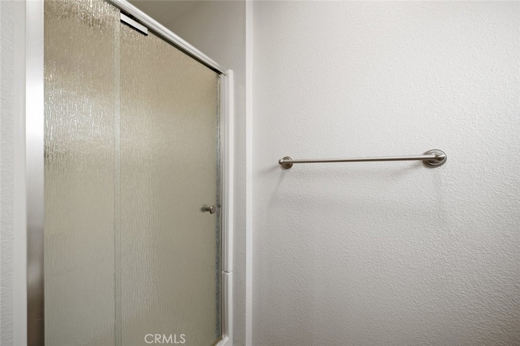 261 Hazel Lane Nipomo, CA 93444 - Photo 45 of 68 a bathroom with a glass shower door