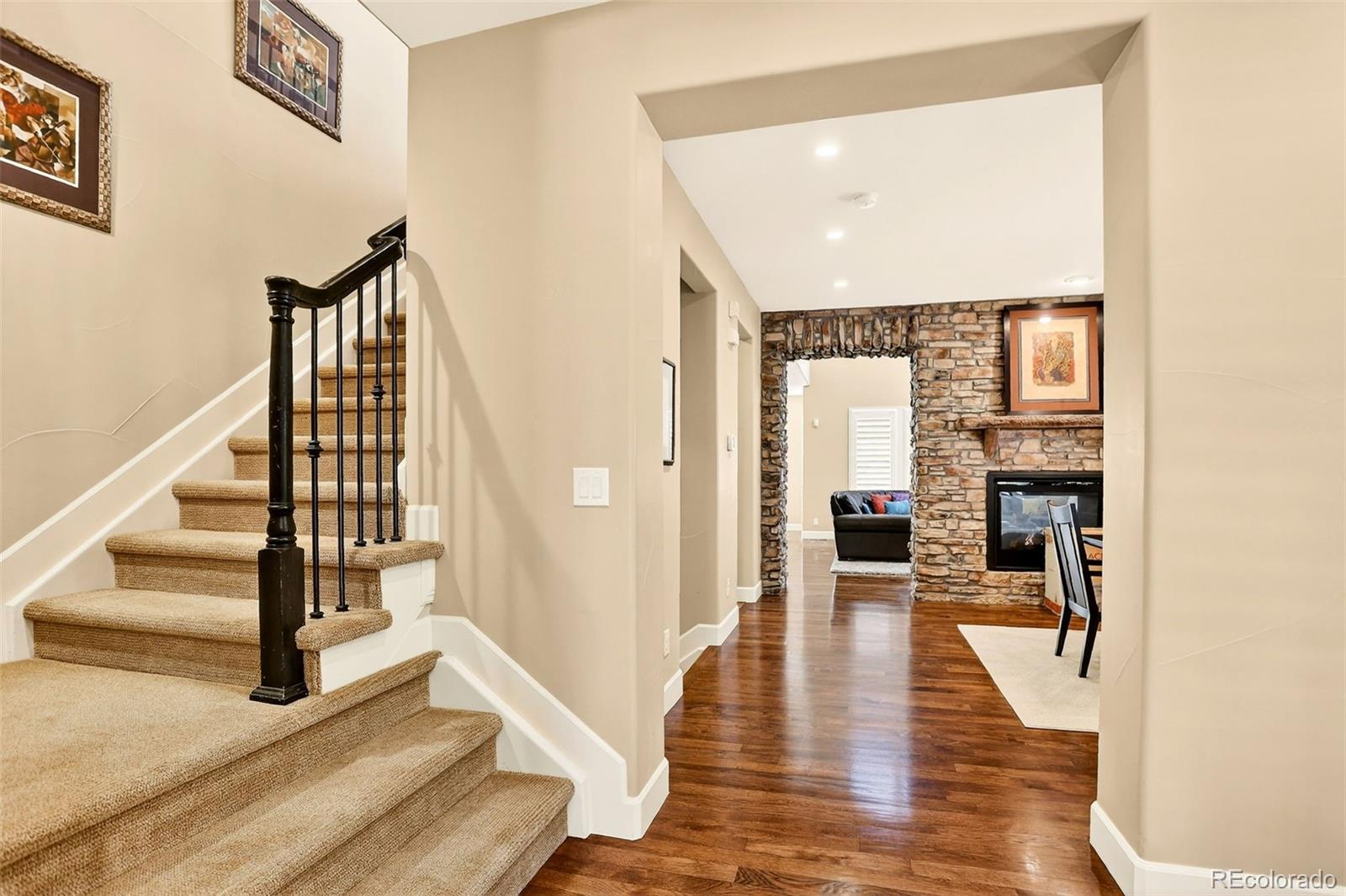 10544 Soulmark Way Highlands Ranch, CO 80126 - Photo 20 of 50 a view of entryway and hall with wooden floor