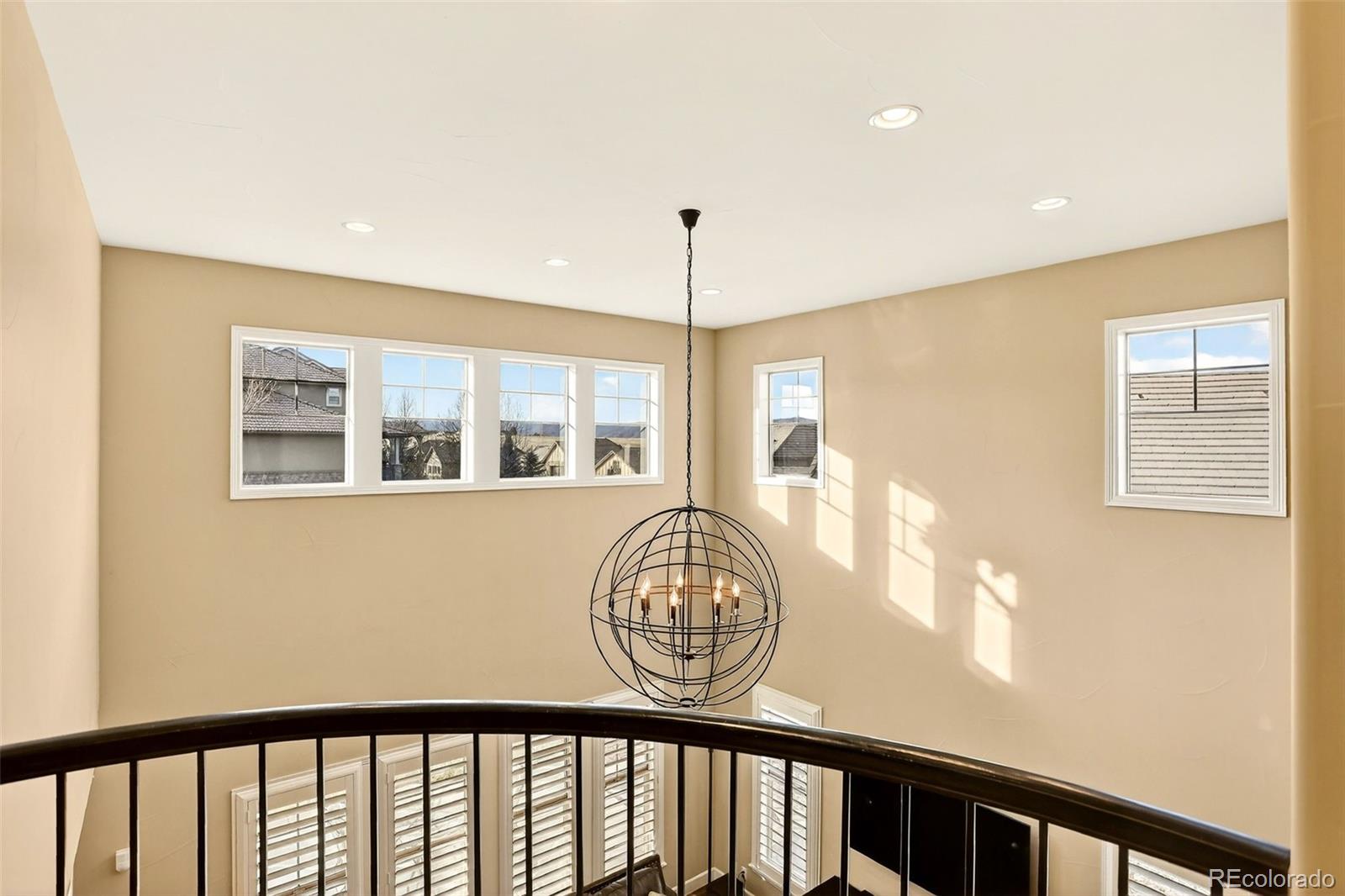 10544 Soulmark Way Highlands Ranch, CO 80126 - Photo 23 of 50 a view of a hallway with wooden floor and a window