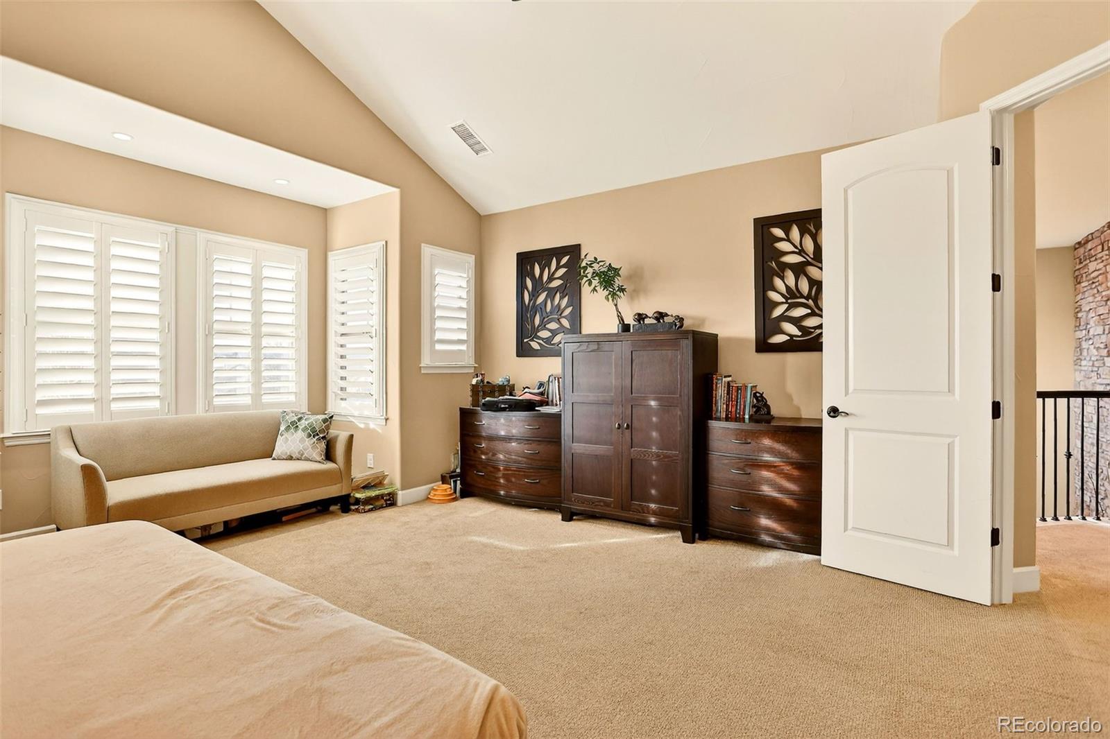 10544 Soulmark Way Highlands Ranch, CO 80126 - Photo 26 of 50 a bedroom with furniture and a window