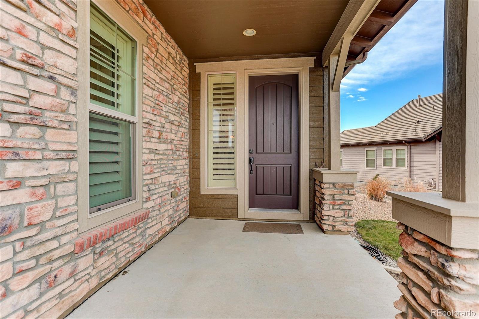 10544 Soulmark Way Highlands Ranch, CO 80126 - Photo 3 of 50 a view of front door of house with stairs