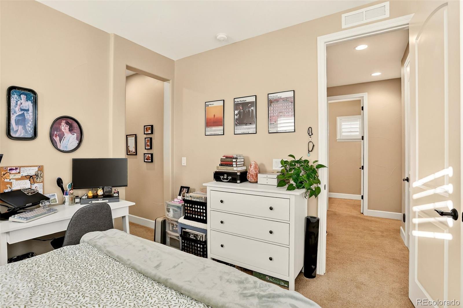 10544 Soulmark Way Highlands Ranch, CO 80126 - Photo 31 of 50 a bedroom with a workspace