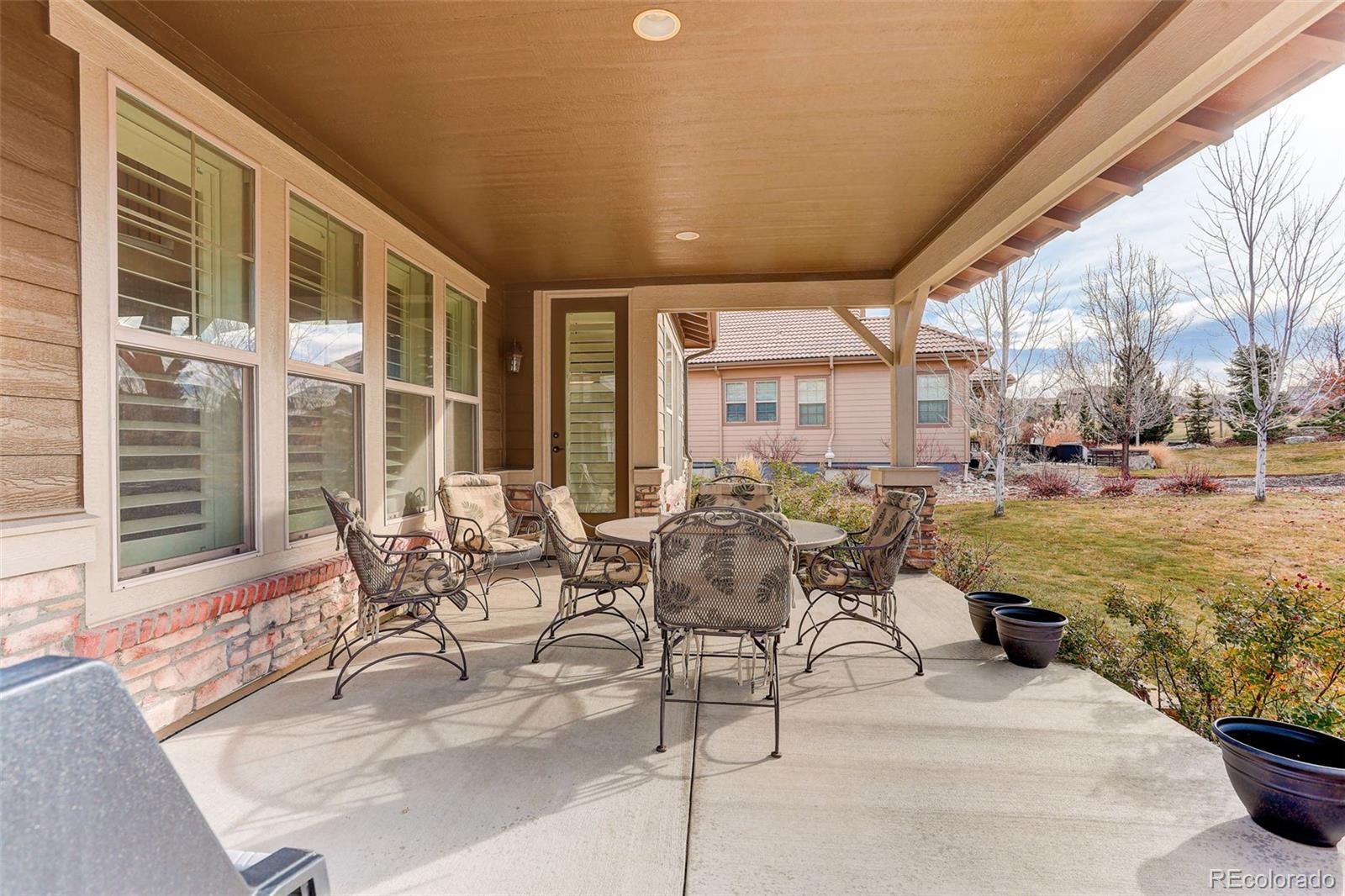 10544 Soulmark Way Highlands Ranch, CO 80126 - Photo 36 of 50 a building outdoor space with patio furniture and garden