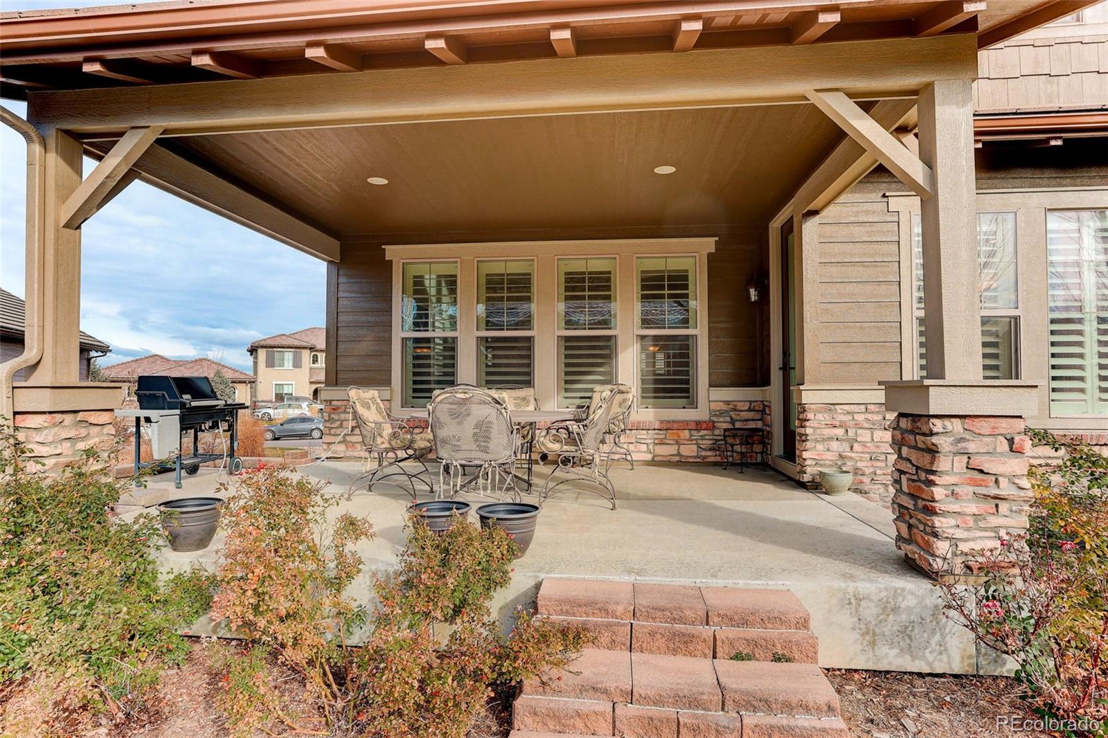 10544 Soulmark Way Highlands Ranch, CO 80126 - Photo 37 of 50 a building outdoor space with patio furniture and potted plants