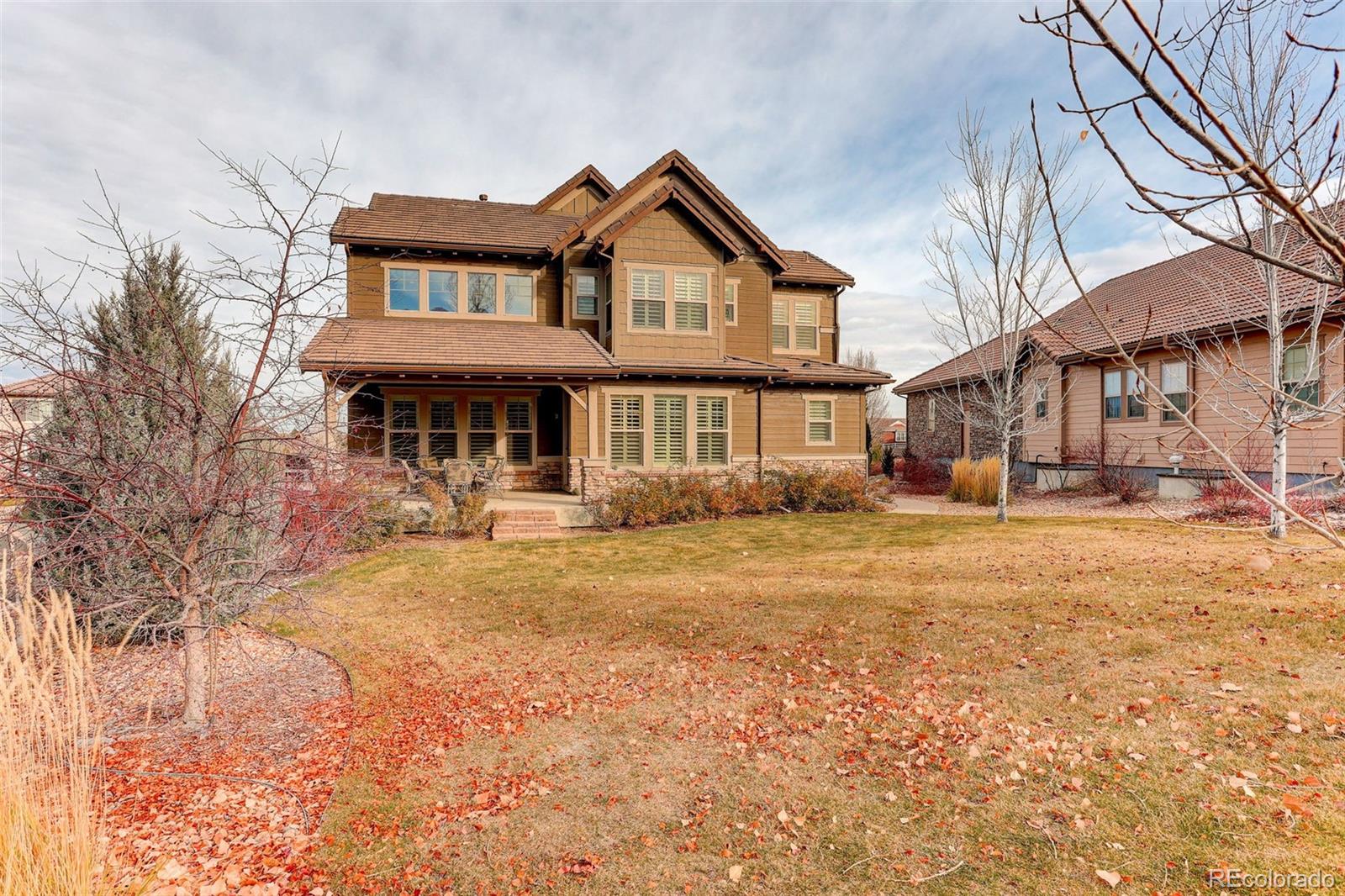 10544 Soulmark Way Highlands Ranch, CO 80126 - Photo 39 of 50 a front view of a house with a yard