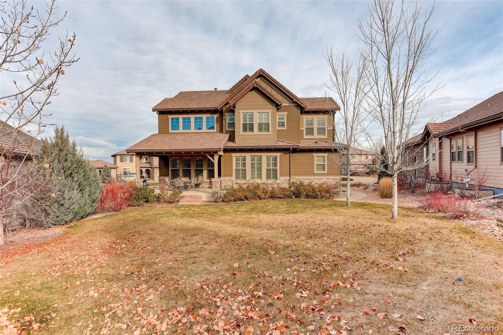 10544 Soulmark Way Highlands Ranch, CO 80126 - Photo 40 of 50 a front view of a house with yard