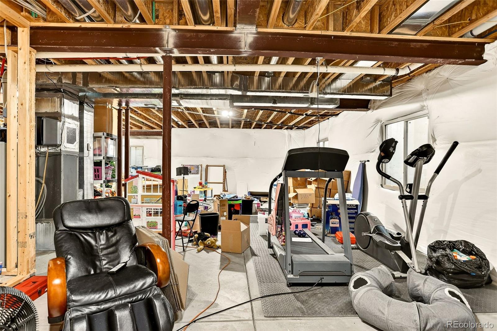 10544 Soulmark Way Highlands Ranch, CO 80126 - Photo 43 of 50 a room with gym equipment