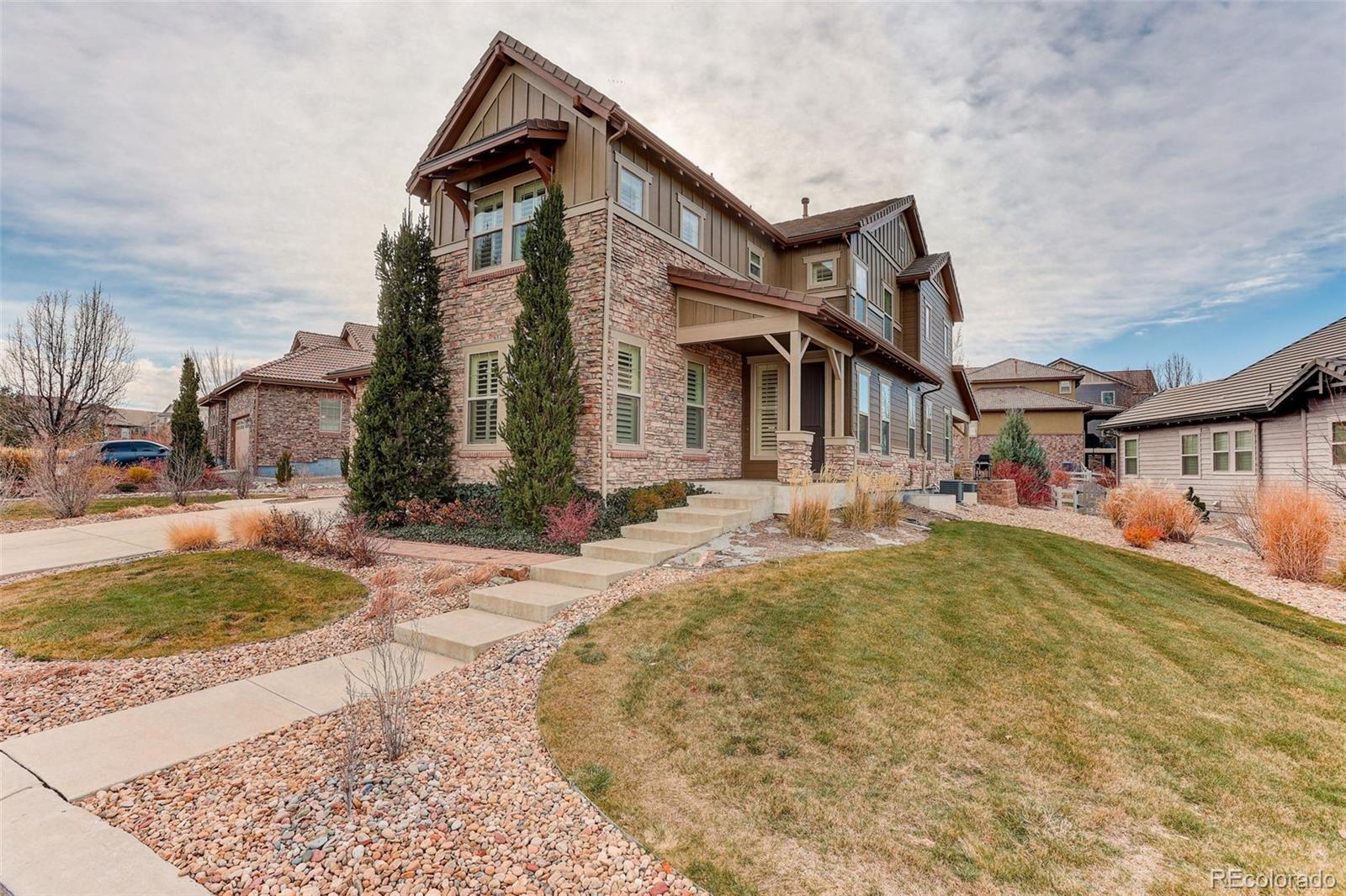 10544 Soulmark Way Highlands Ranch, CO 80126 - Photo 46 of 50 a front view of a house with swimming pool