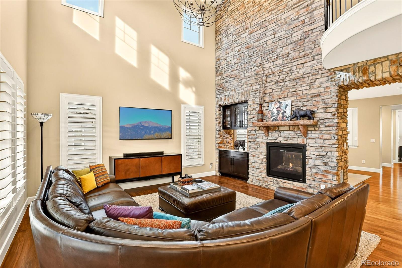 10544 Soulmark Way Highlands Ranch, CO 80126 - Photo 8 of 50 a living room with fireplace furniture and a fireplace