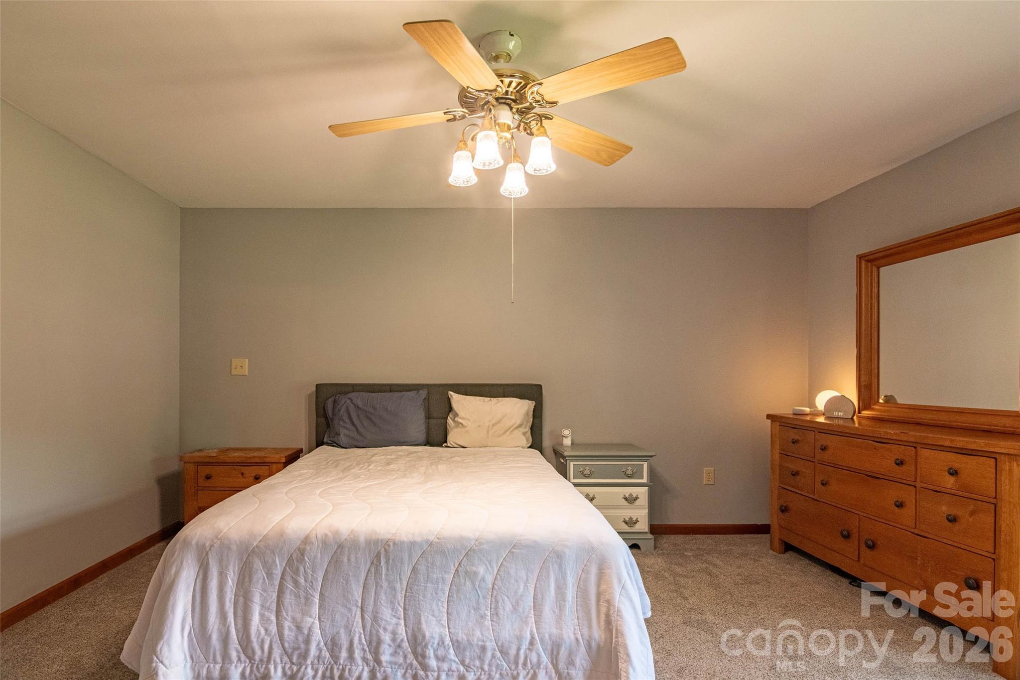 445 Old Caroleen Road Forest City, NC 28043 - Photo 11 of 28 a bedroom with a bed and a dresser