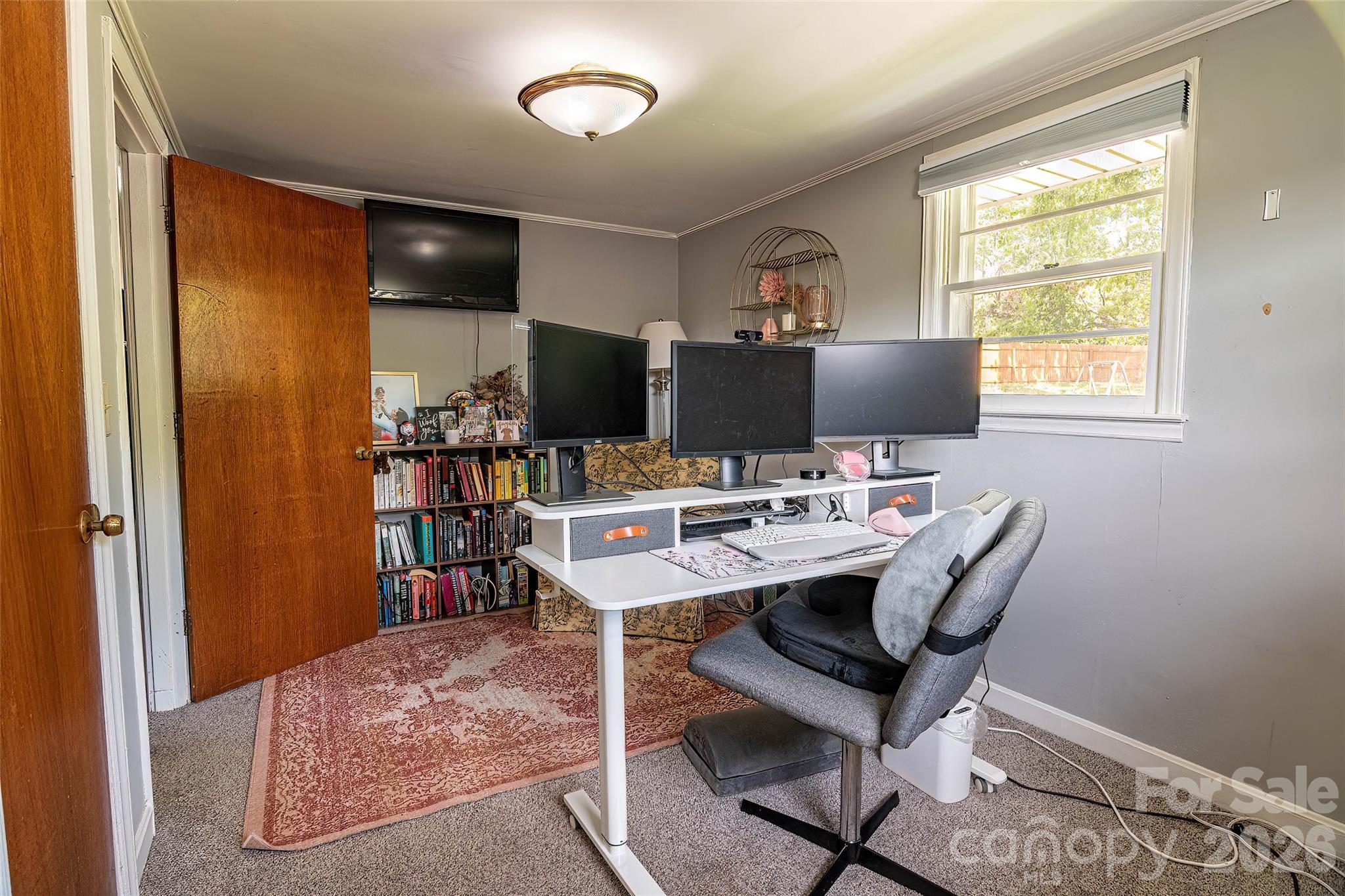 445 Old Caroleen Road Forest City, NC 28043 - Photo 17 of 28 a view of a workspace with furniture and a window