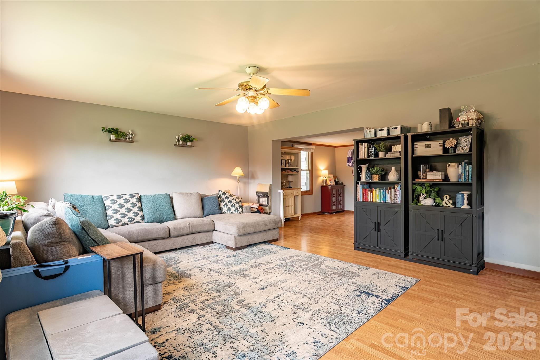 445 Old Caroleen Road Forest City, NC 28043 - Photo 2 of 28 a living room with furniture a rug and chandelier