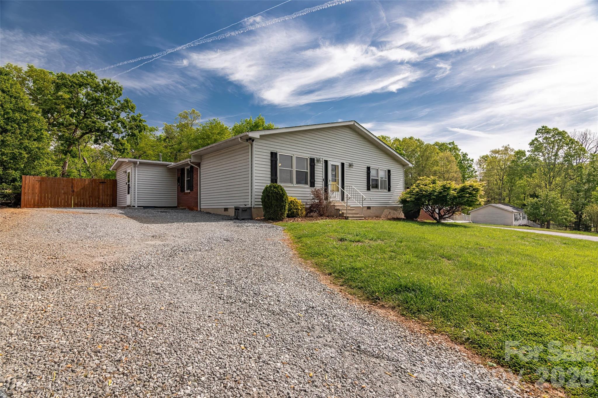 445 Old Caroleen Road Forest City, NC 28043 - Photo 27 of 28 a view of a house with a yard and potted plants
