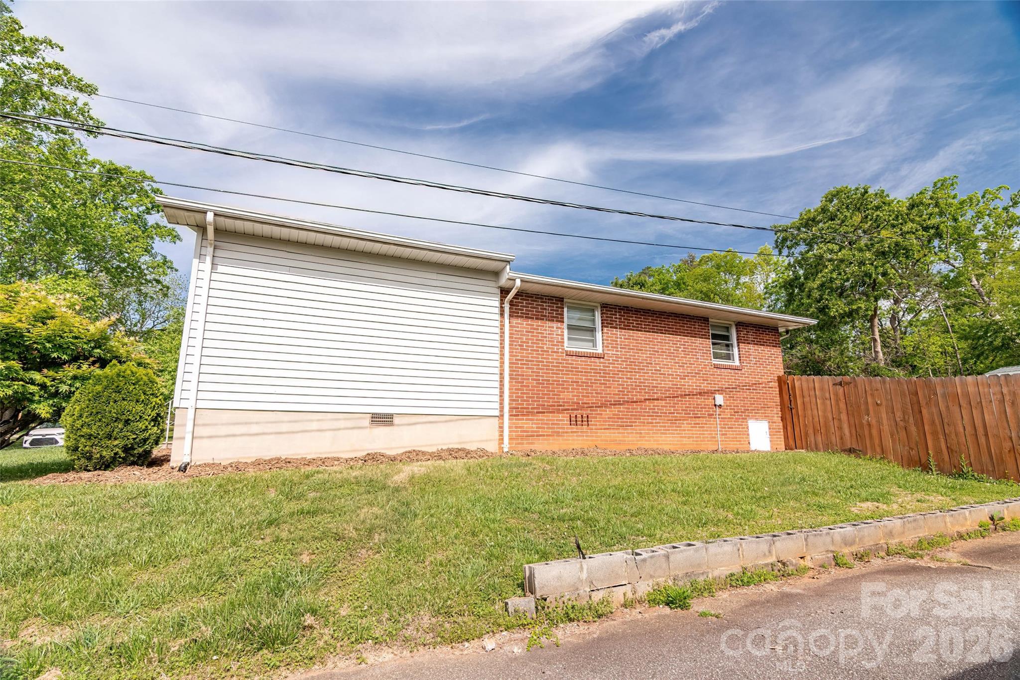 445 Old Caroleen Road Forest City, NC 28043 - Photo 28 of 28 a backyard of a house with lots of green space