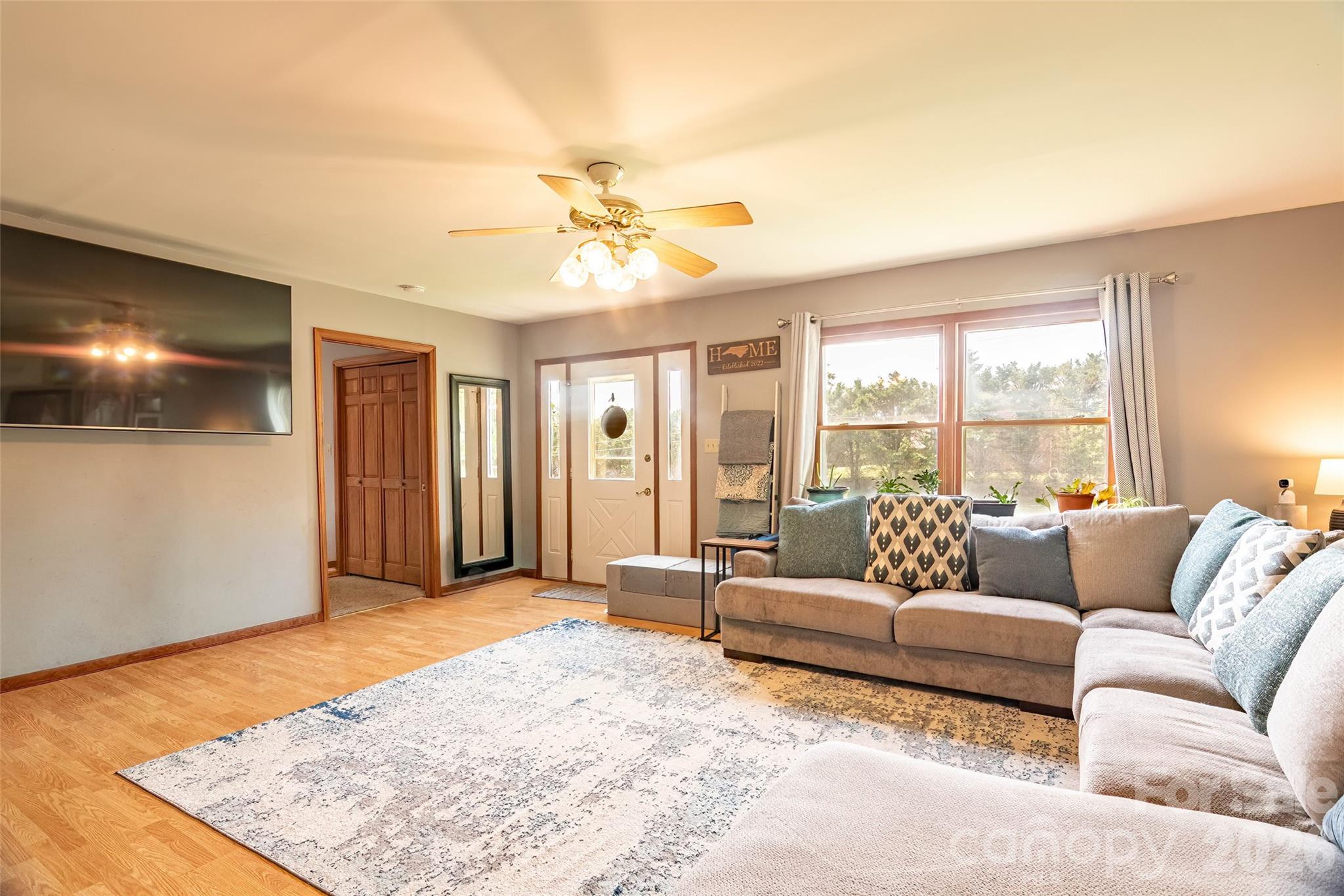 445 Old Caroleen Road Forest City, NC 28043 - Photo 3 of 28 a living room with furniture and a flat screen tv