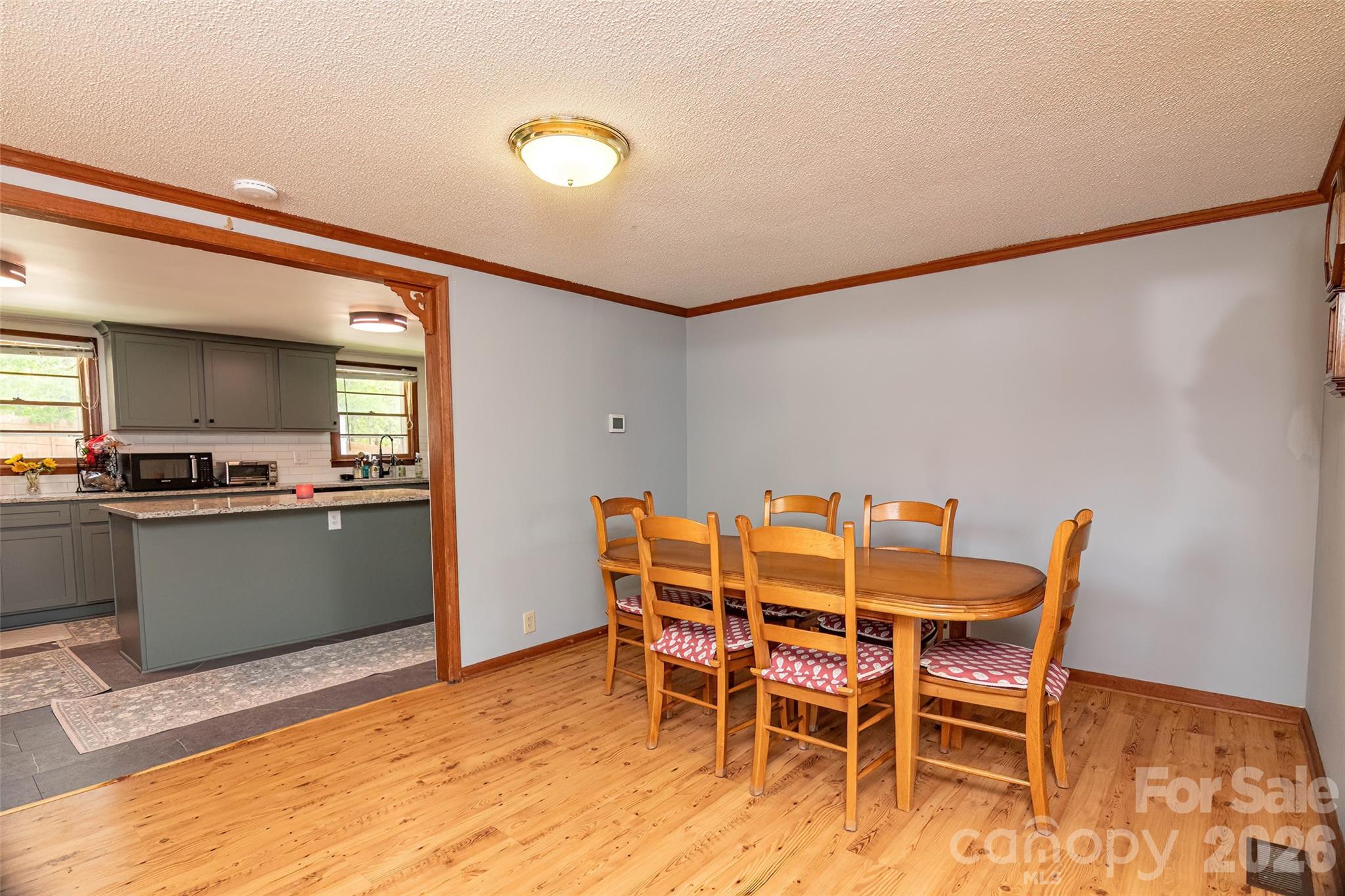 445 Old Caroleen Road Forest City, NC 28043 - Photo 5 of 28 a view of a dining room with furniture and wooden floor