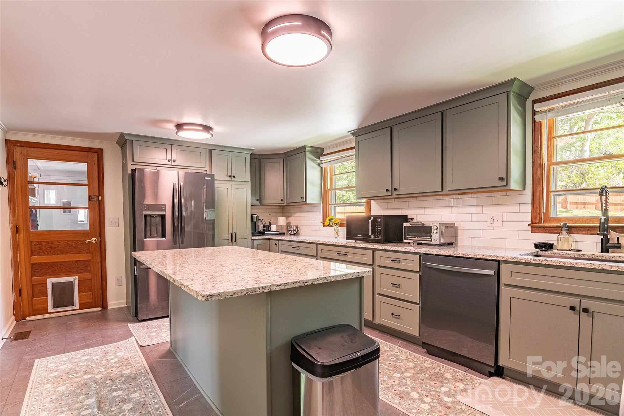445 Old Caroleen Road Forest City, NC 28043 - Photo 7 of 28 a kitchen with a stove a sink and a refrigerator