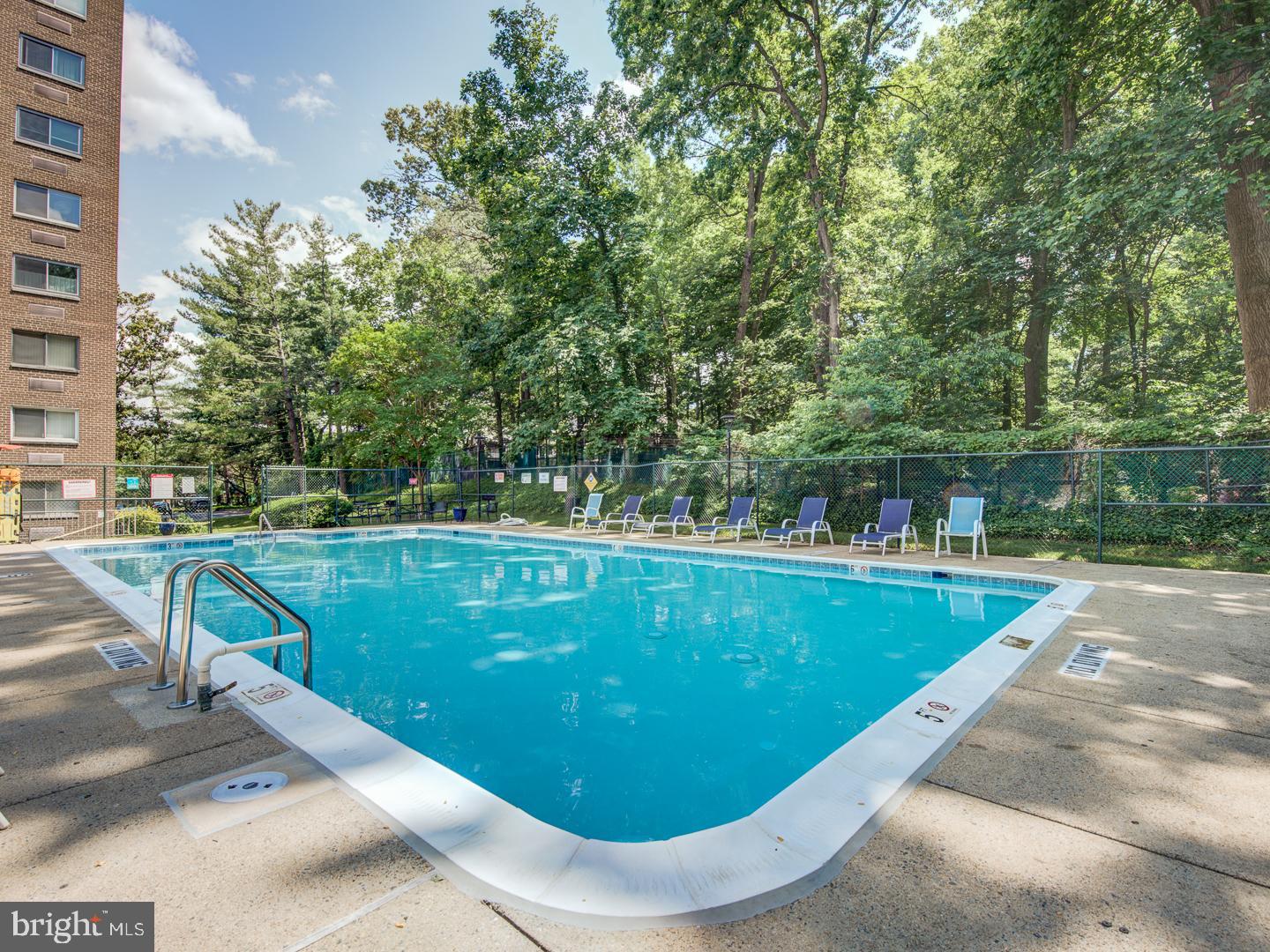 2059 Huntington Avenue, Unit 300 Alexandria, VA 22303 - Photo 28 of 30 a view of a swimming pool with a patio