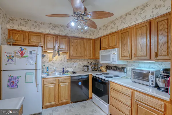 a view of a kitchen with appliances and cabinets