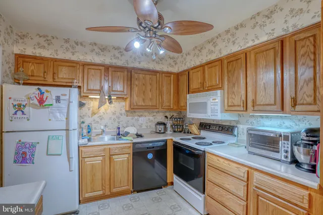 a view of a kitchen with appliances and cabinets