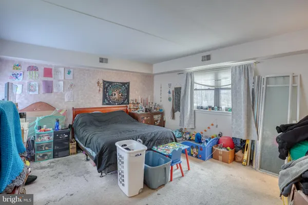 a bedroom with a bed and furniture