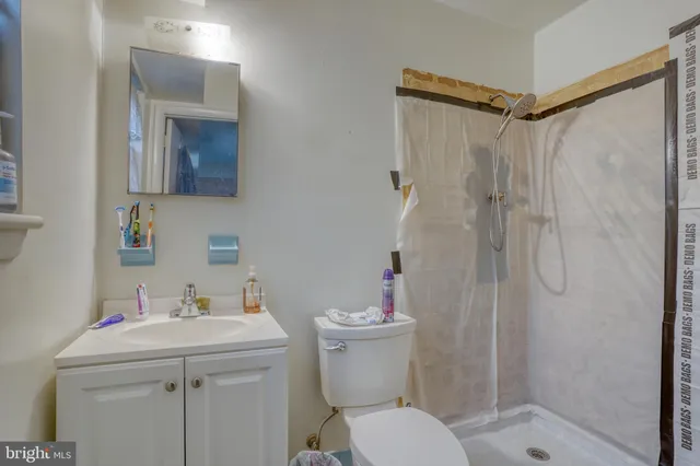 a bed room with a bed and a chair