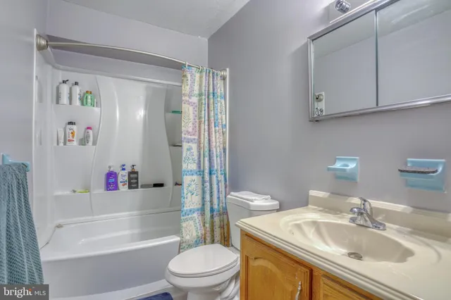 a kitchen that has a sink and a stove in it