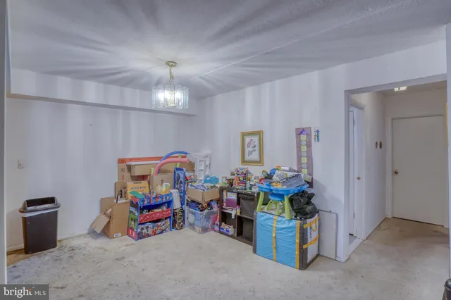 a storage room with furniture and chandelier